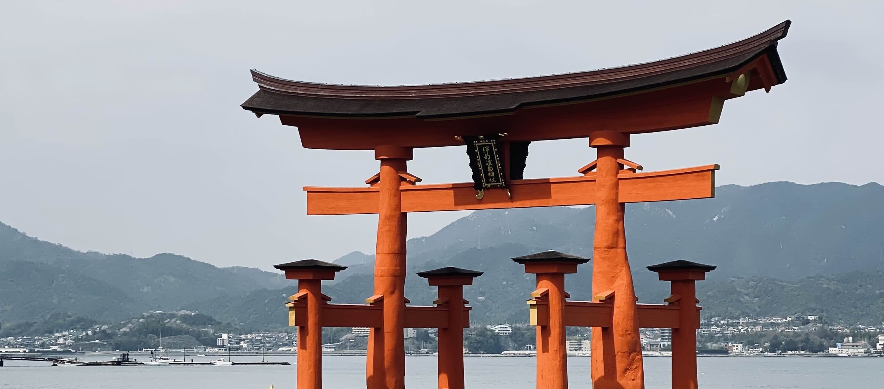 a picture of a torii gate in the water